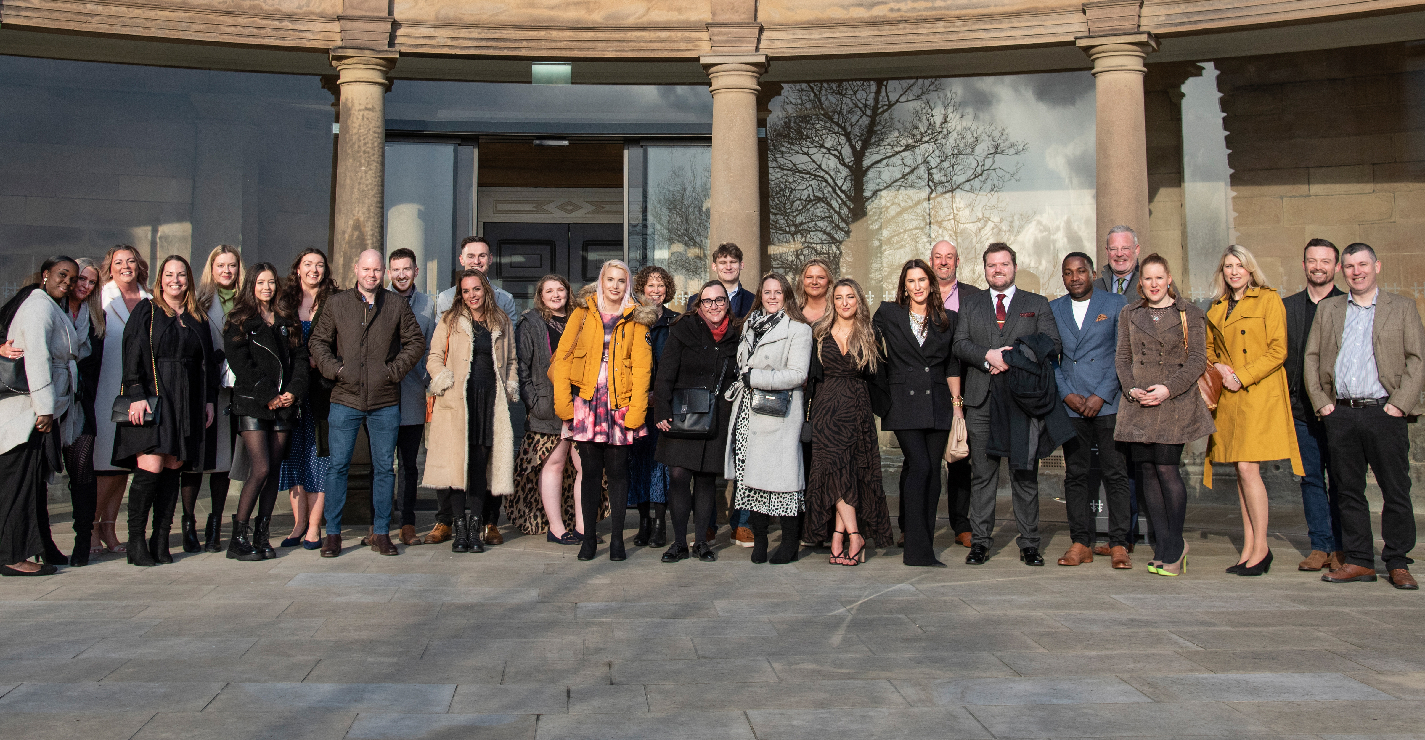 Photograph of the EMEA Recruitment team standing in front of the Ducal Palace at Nottingham Castle